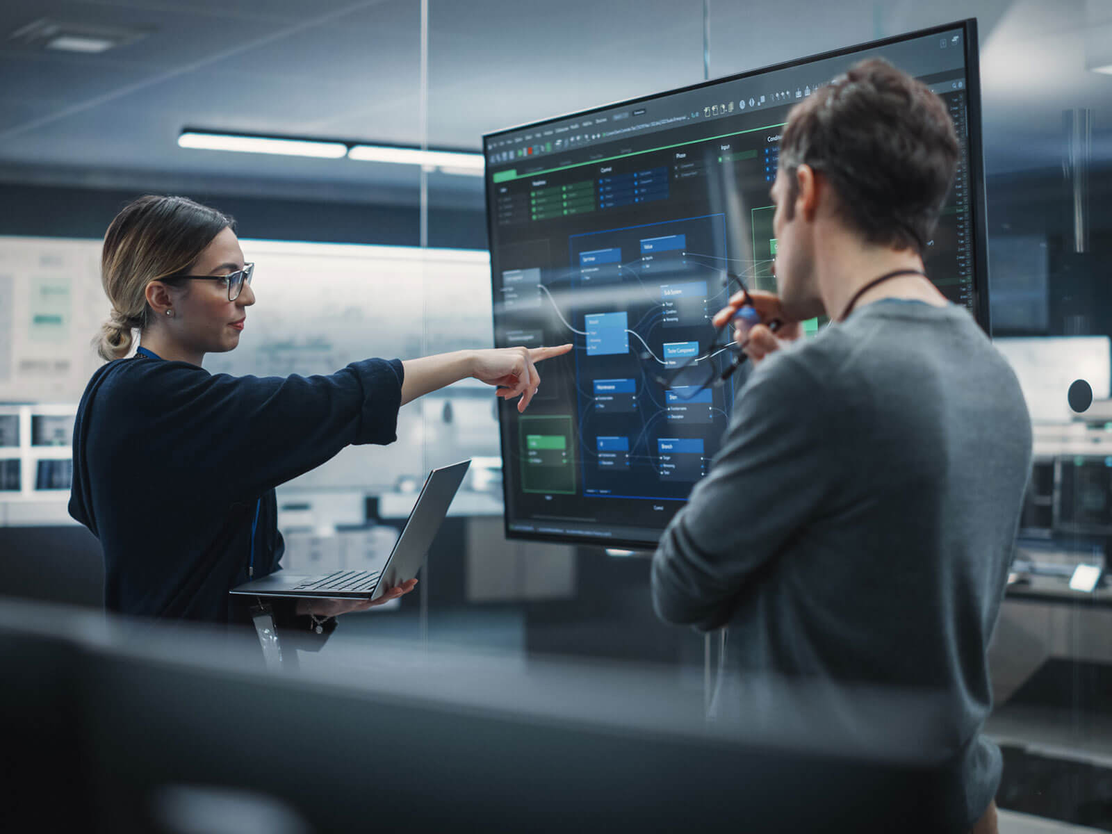 Woman looking at computer screens