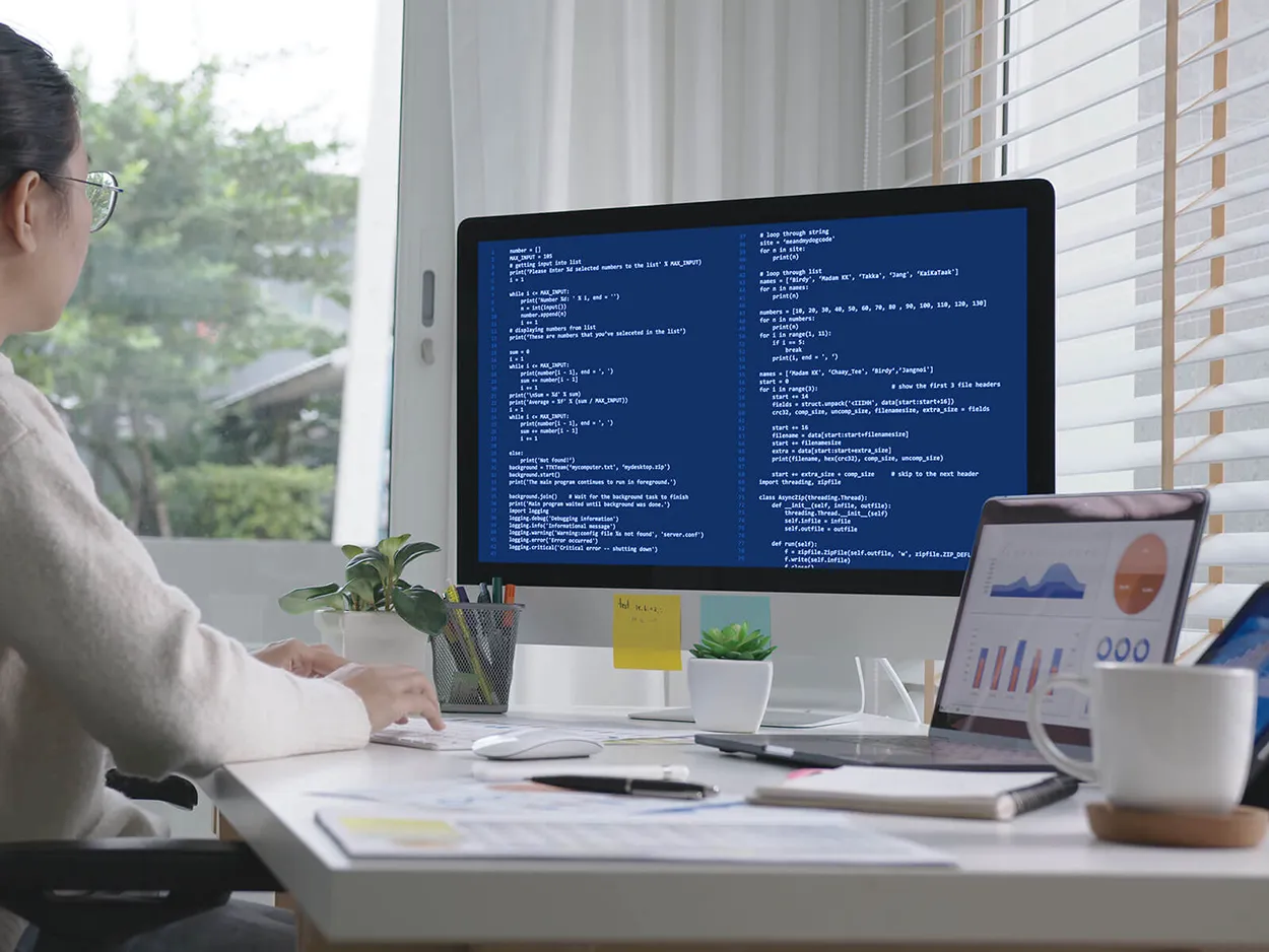 Woman coding to process data and create dashboards, symbolizing data science work